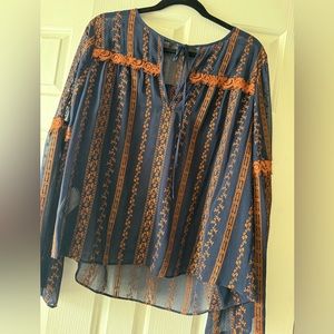 BCBGMaxazria's top in blue with prints